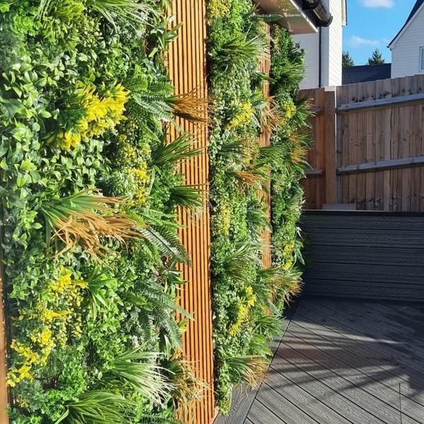Artificial Green Wall Panel with Variegated Mixed Green, Yellow, Red Foliage & White Flowers 100x100 cm Pure Clean Rental Solutions